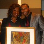Omari Hardwick (Rising Star Award) with Kathleen Bertrand.